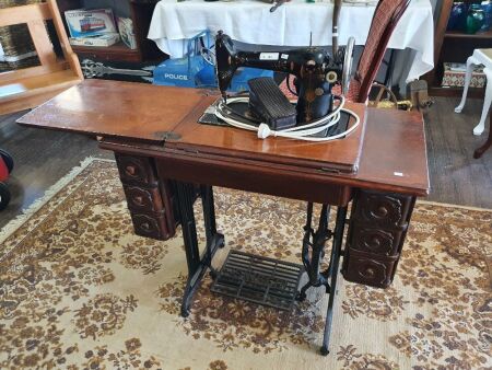 Singer sewing machine on stand