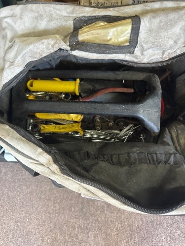 Tool bag containing C-clamps and miscellaneous tools