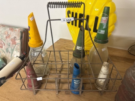 Selection of Oil Cans Plastic/ Glass & Tin dust covers in stand