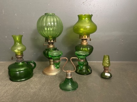 4 various sized green glass kerosene lanterns + green candle holder