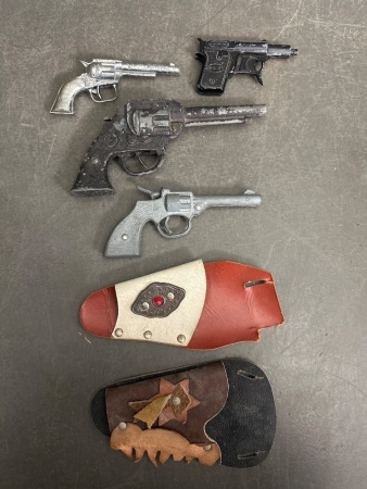 Assortment of Toy Guns and Holsters