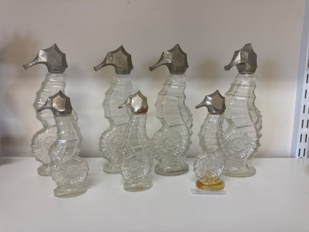 7 Various Sized Avon Sea Horse Decanters
