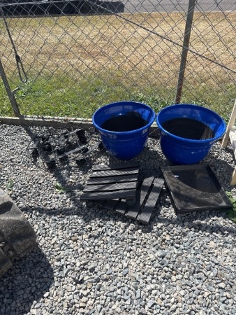 2x Blue plastic garden pots and 5 x stands on wheels