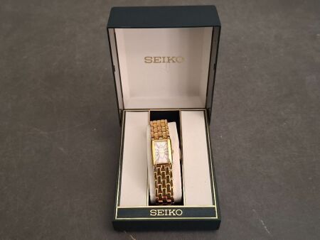 Seiko Stainless Steel Gold Look with Pink Face Ladies Watch - 1N00-F190 - In Original Box