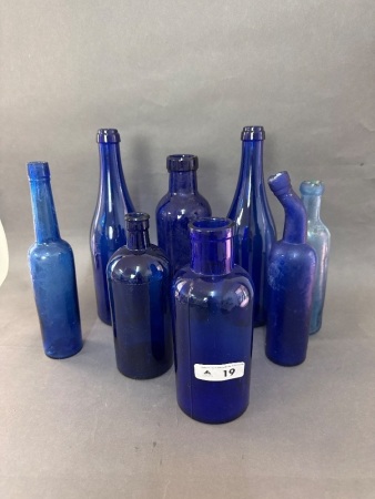 Assortment of Vintage Dark Blue Glass Bottles