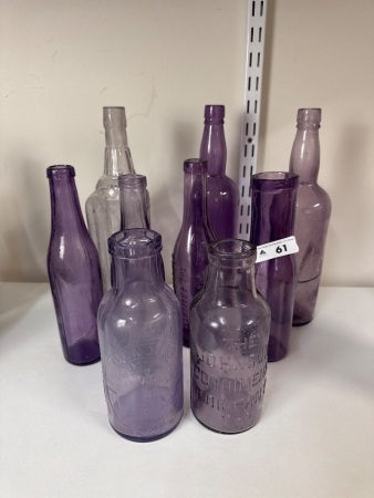 Large Assortment of Purple Glass Bottles - 5 Embossed