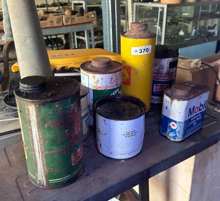 Assorted grease and oil tins