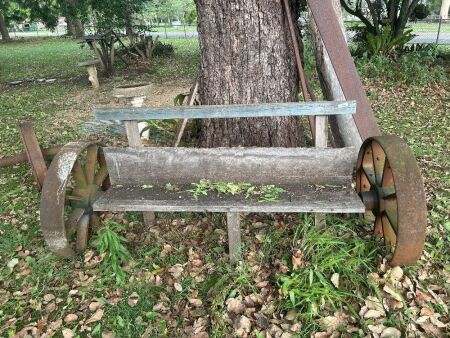 Outdoor bench seat on heavy axle/wheels - wheels marked J B Uncle and Sons