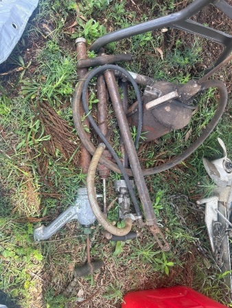 A grease gun and 3 oil pumps