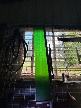 Green glass windscreen for old model vehicle with 2 brass struts