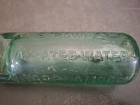 2 Collectable Bottles - 1 J.S.Rowleys Warrnambool & Hamilton Bottle + 1 Property of O.T Ltd Melbourne Bottle - 2
