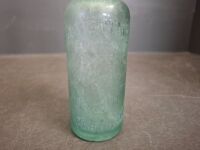 2 Collectable Bottles - 1 J.S.Rowleys Warrnambool & Hamilton Bottle + 1 Property of O.T Ltd Melbourne Bottle - 7