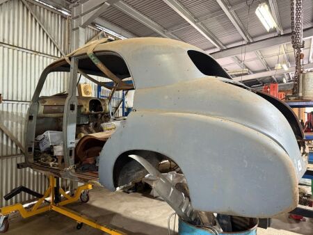 FJ Holden body on rotisserie + large lot of panels - note: additional panels in small shed