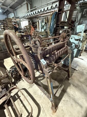 Hand cranked corrugated iron roller