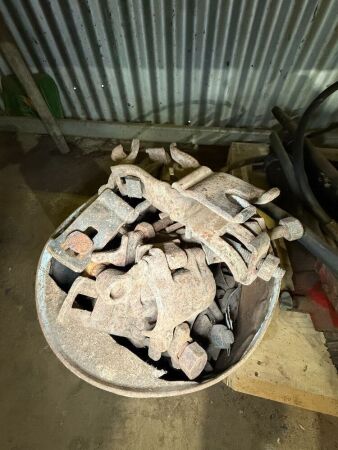 Bucket of scaffolding pipe clamps