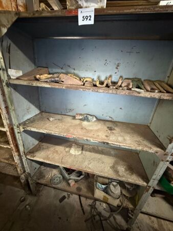Shelvng unit with contents inc bucket teeth