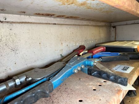 Shelf lot of rivet guns and rivets