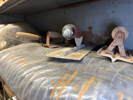 Shelf lot of concreting tools and supplies
