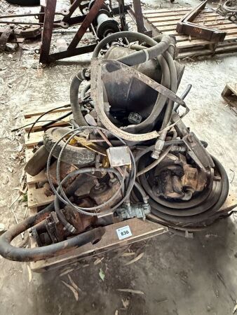 Pallet of assorted hydraulic pumps and hose