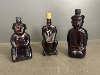 Mid 20th‑century amber glass figural liquor/novelty bottles x3 Kailua