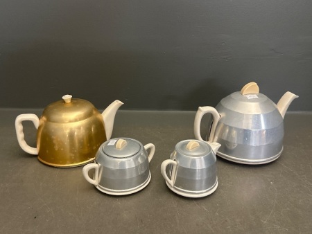 Assortment of Ceramic with Metal Cover Teapots