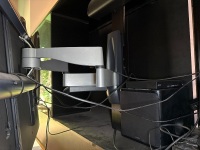 Large lot of entertainment pieces including LGTV Yamaha sound system Infinity speakers etc. - TV mounted on telescopic arms - DVDs and extra speakers included - 2