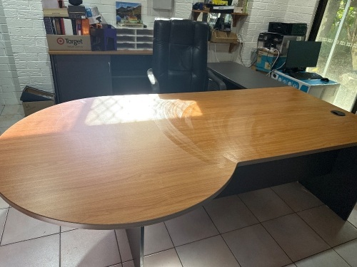 Office setting including corner unit, desk, cabinet and executive style office chair