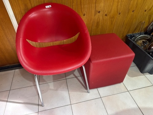 Red plastic chair with footstool