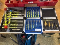Masonry drill bits and step cone drill bits