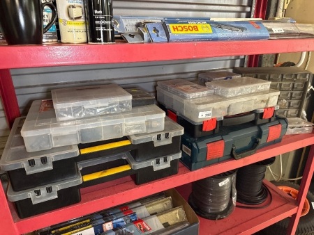Shelf lot of organising boxes with contents