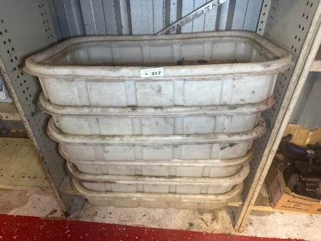 Quantity of shallow plastic tubs