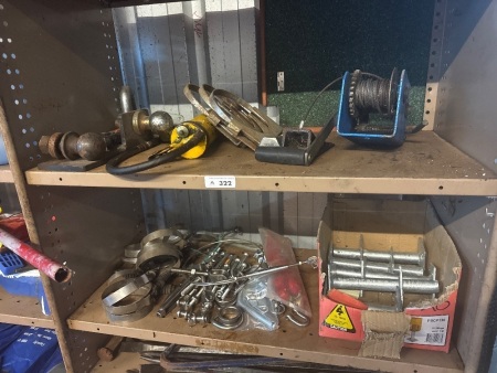 Two shelves of assorted items including grease gun winch, wire, tensioners hose clamps, etc