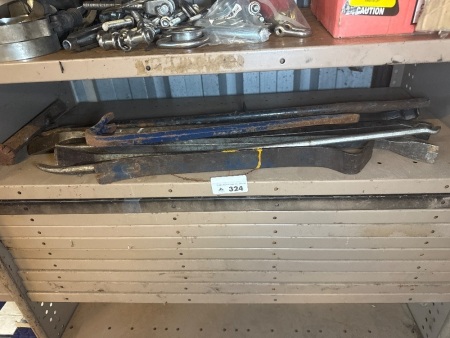 Shelf lot of assorted tyre levers and wrench bars