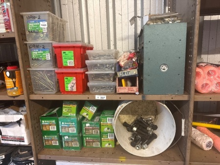 Two shelves of assorted bolts and screws, etc