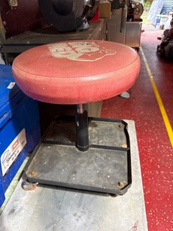 Big Red mechanics chair on castors
