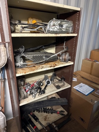 Four shelves of assorted car parts