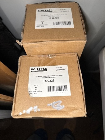 2 boxes of Rolltrak top mount cabinet barn door track set - as new boxed