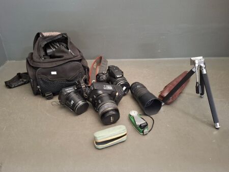 2 Nikon Cameras + Canon Camera in Bag with Equipment
