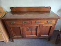 Vintage sideboard with carved door and brass handles