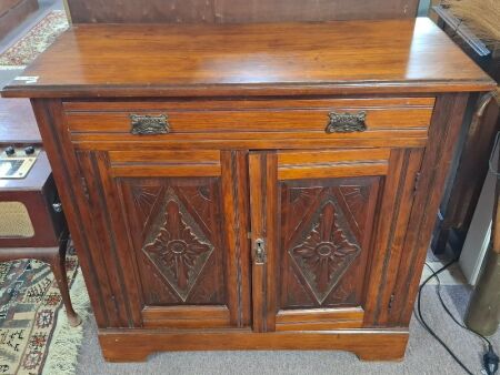 Vintage sideboard with carved doors