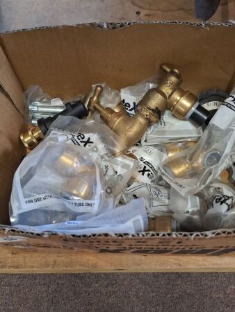 Assorted brass, galvanised, and poly tap fittings