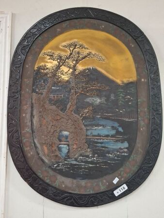 Relief artwork in carved wooden from with copper insert