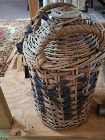 Vintage wicker wrapped demijohn