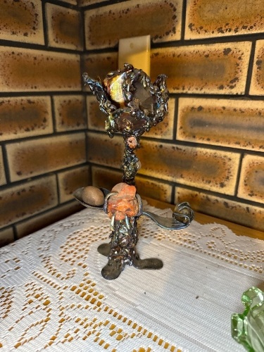 Metal art sculpture made from mostly kitchen cutlery
