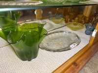 Shelf lot of various coloured glassware