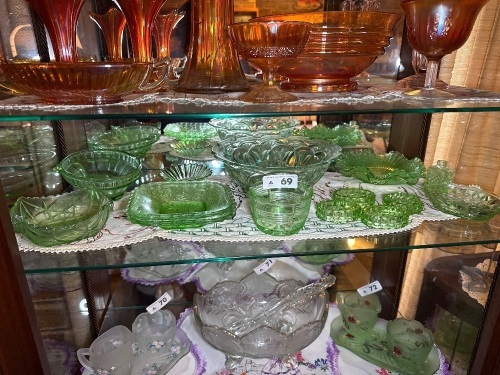 Shelf lot of green depression glassware