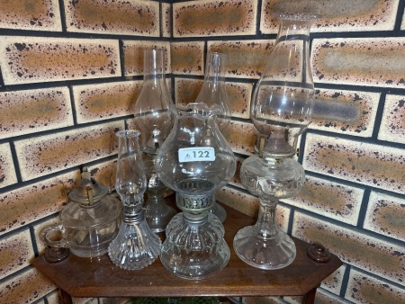 Assortment of clear glass oil lamps