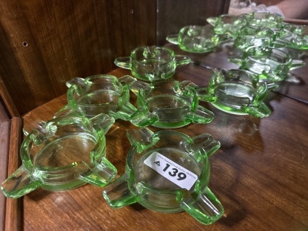 Assortment of green glass ashtrays