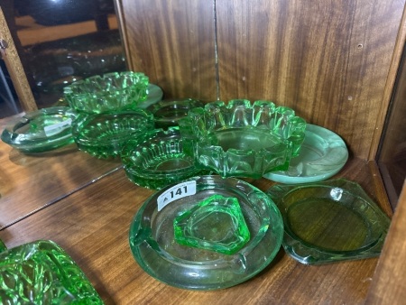 Assortment of green glass ashtrays