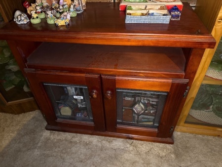 Wooden entertainment unit with lead light glass doors